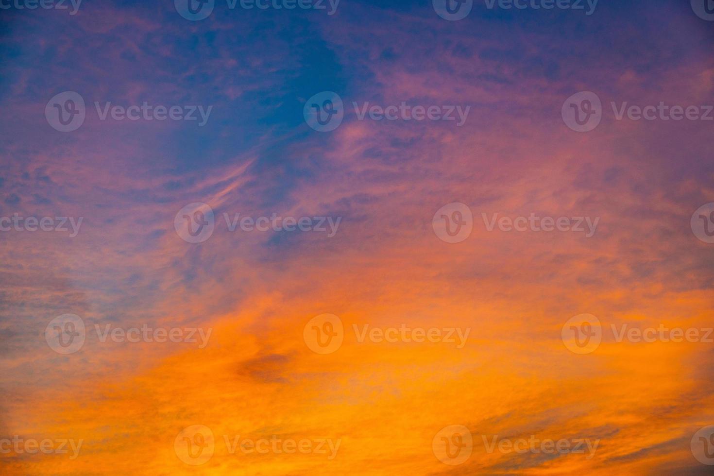 original sky background with clouds during colorful sunset photo