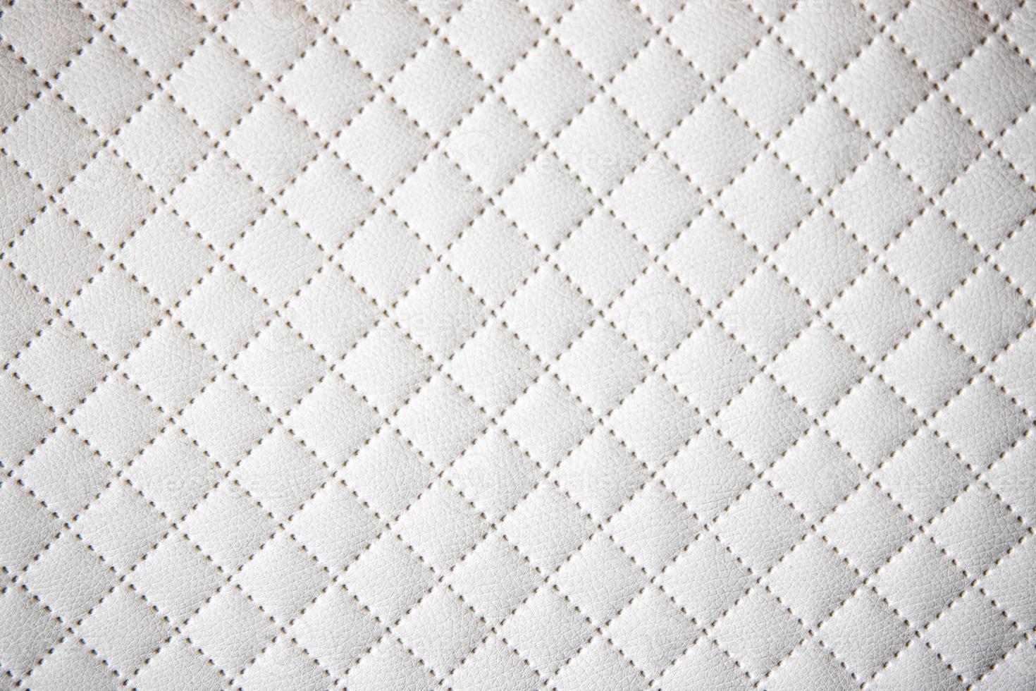 interesting original white leather background with quilting pattern photo