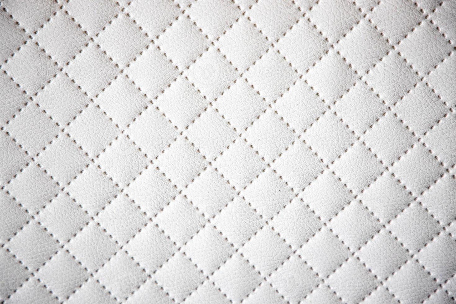 interesting original white leather background with quilting pattern photo