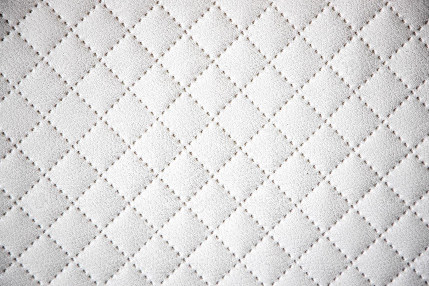 interesting original white leather background with quilting pattern photo