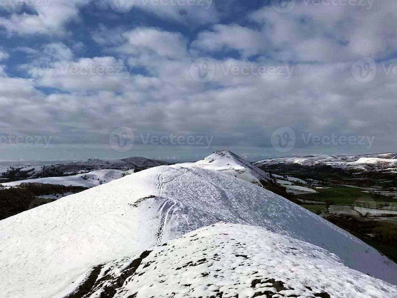 A view of the Caradoc Hils in winter with Snow on Top photo