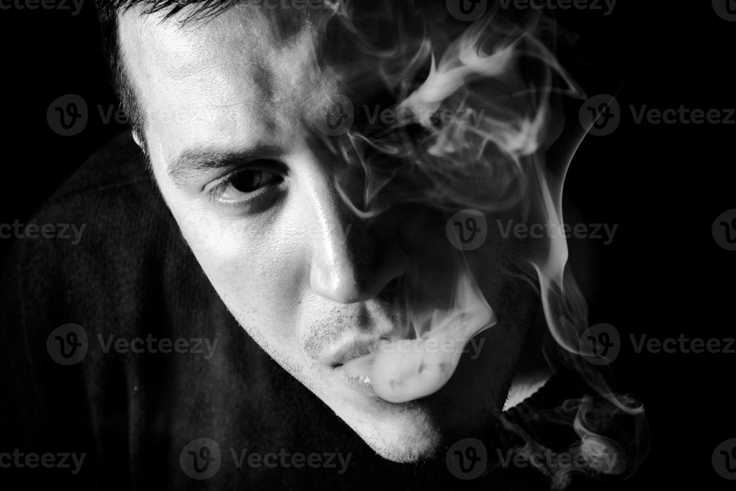 Smoking man low key photo