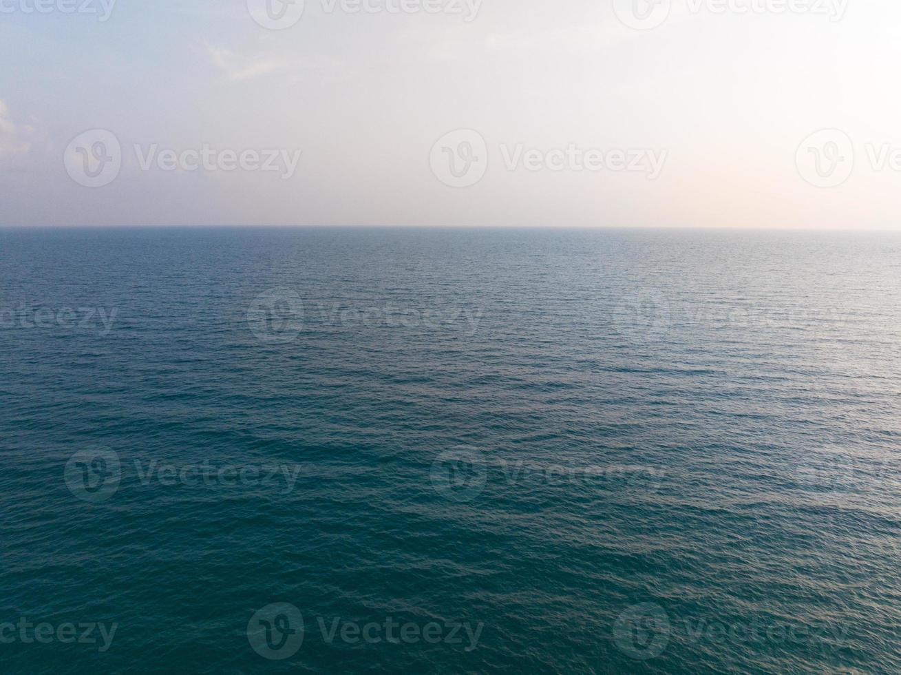 Aerial drone view of ocean with turquoise sea water and palm trees of Gulf of Thailand. Kood island, Thailand photo