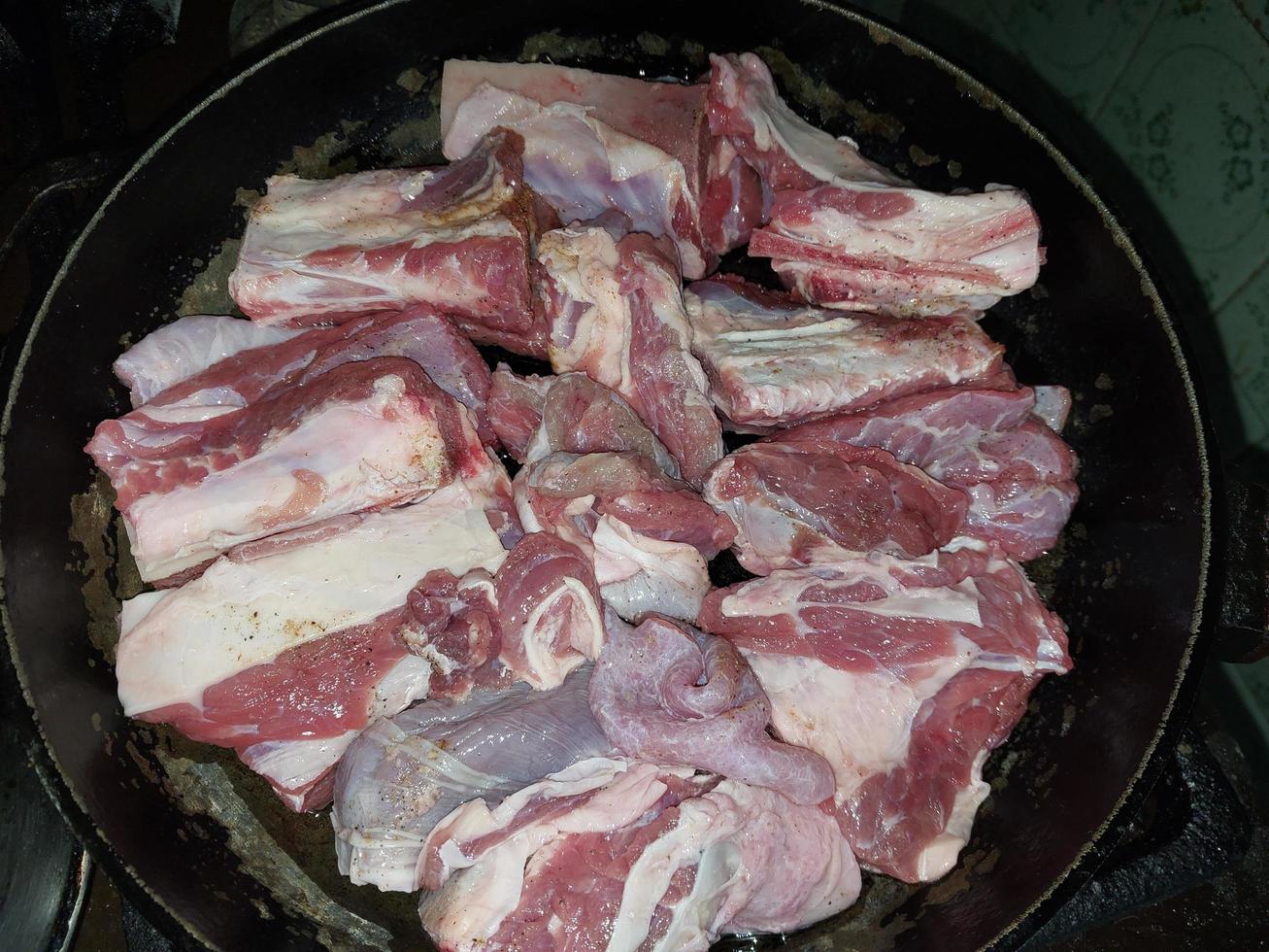 Cooking veal ribs in a pan photo