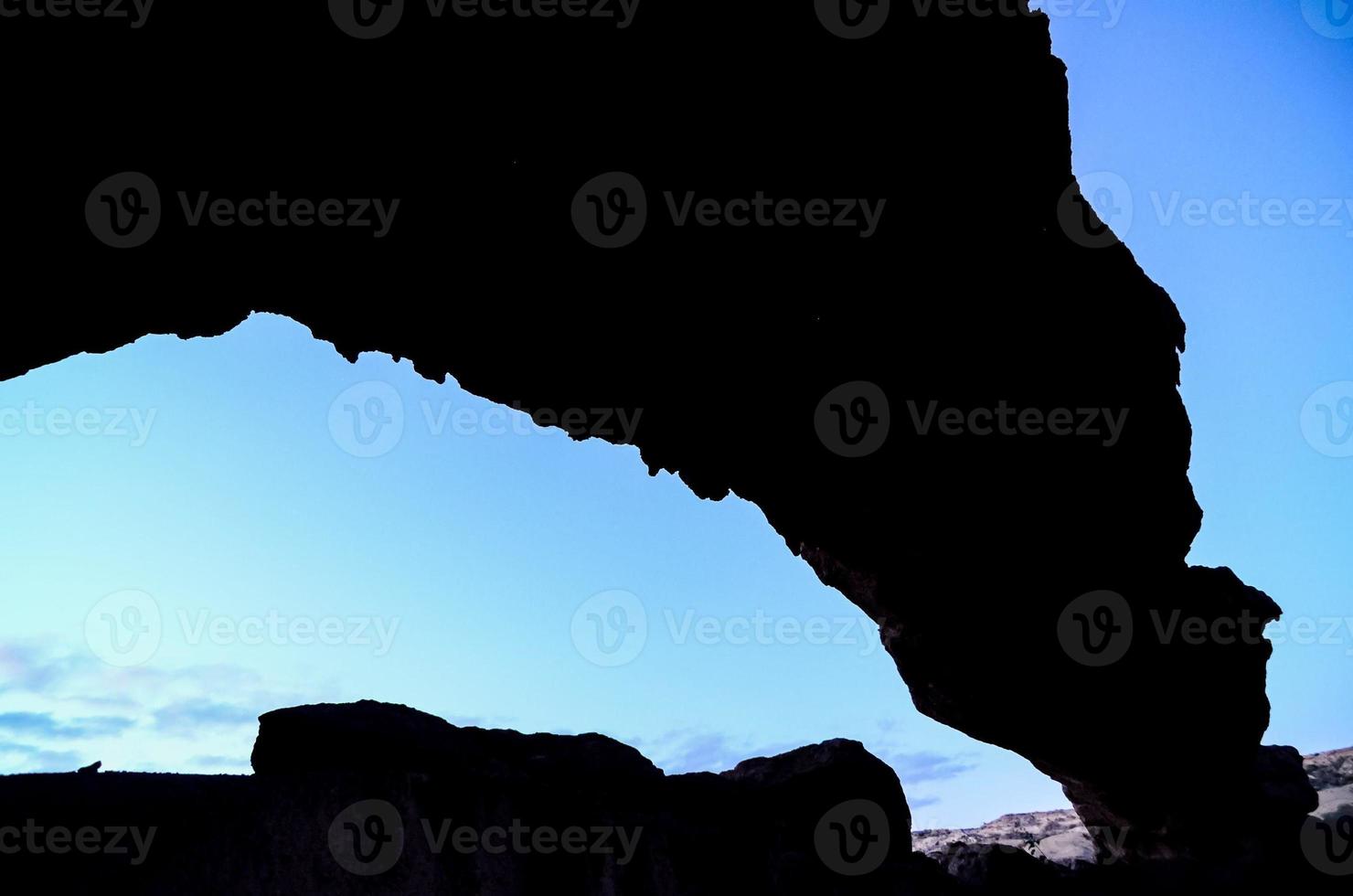 Silhouette of a rock formation photo