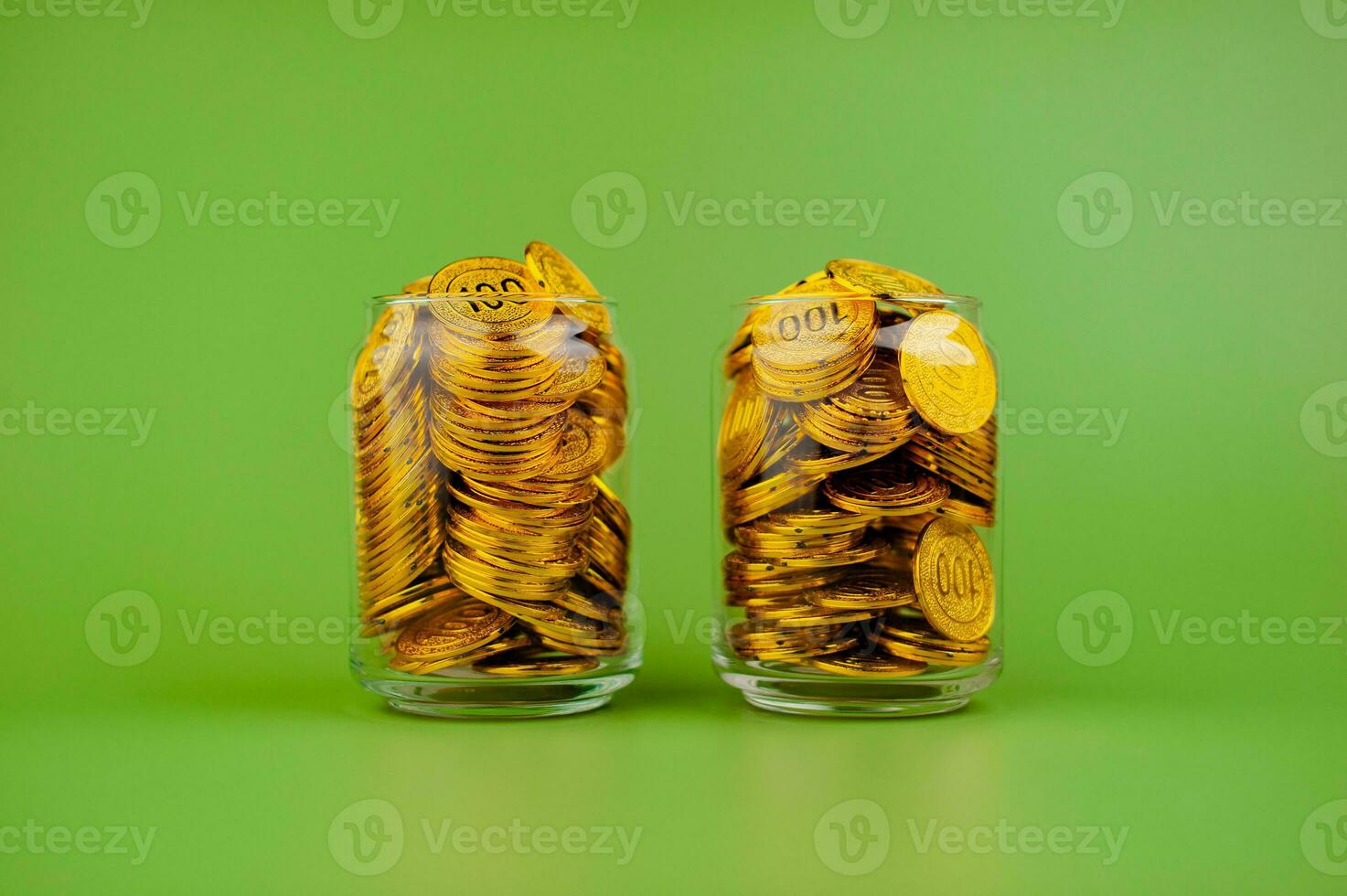 gold coins in a glass jar Gold savings concept. Lots of gold. Gold stocks. photo