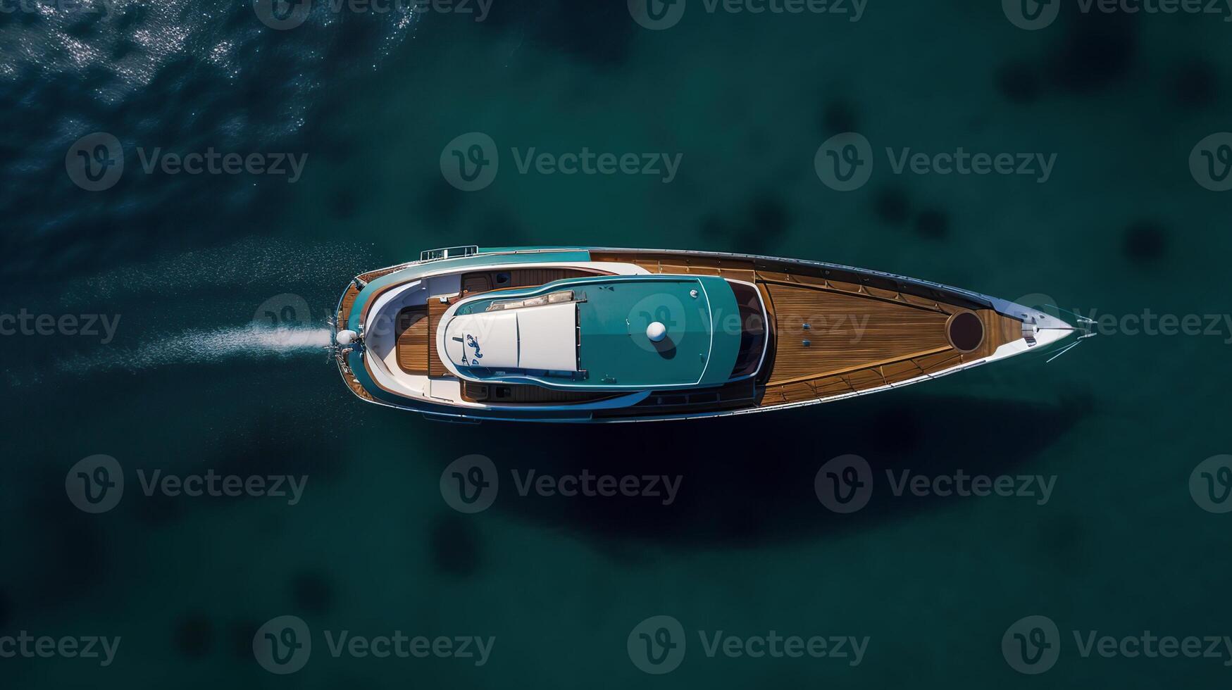 Aerial drone top down photo of luxury yacht nose with wooden deck anchored ,