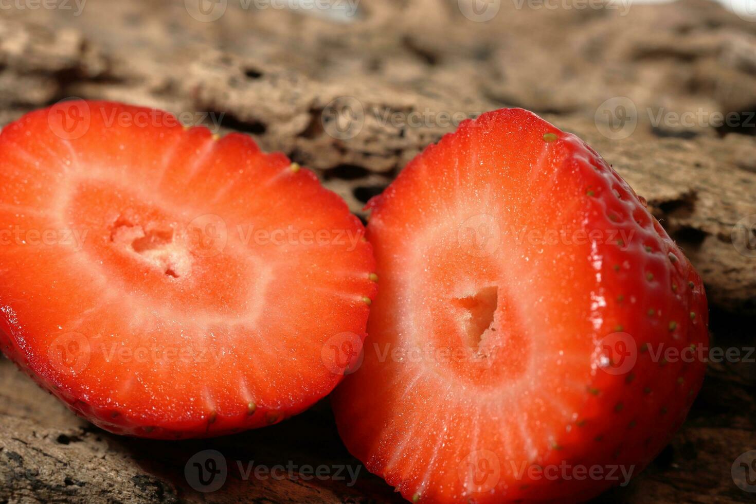 Fresh strawberry half slice in close up view. Macro photo