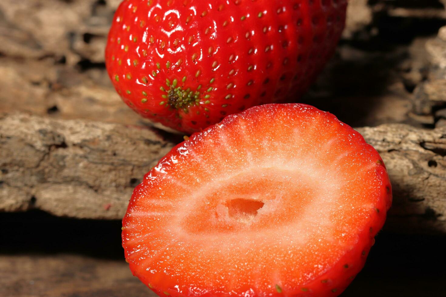 Fresh strawberry close up with slices photo