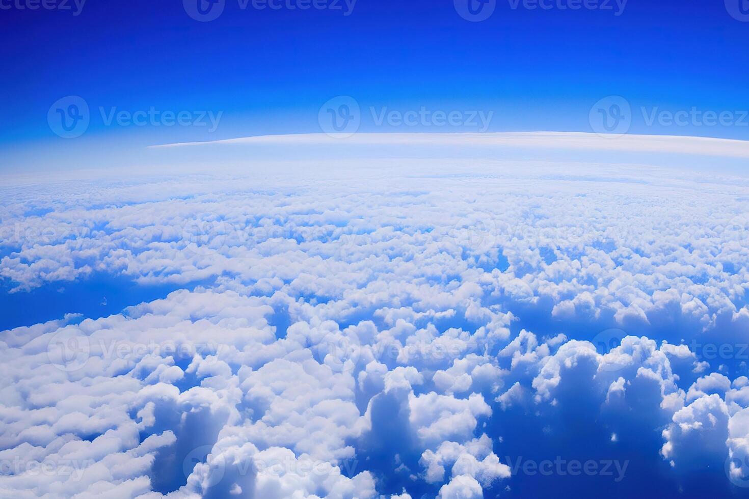 View of the sky above clouds over the earth deep blue sky with white clouds. photo