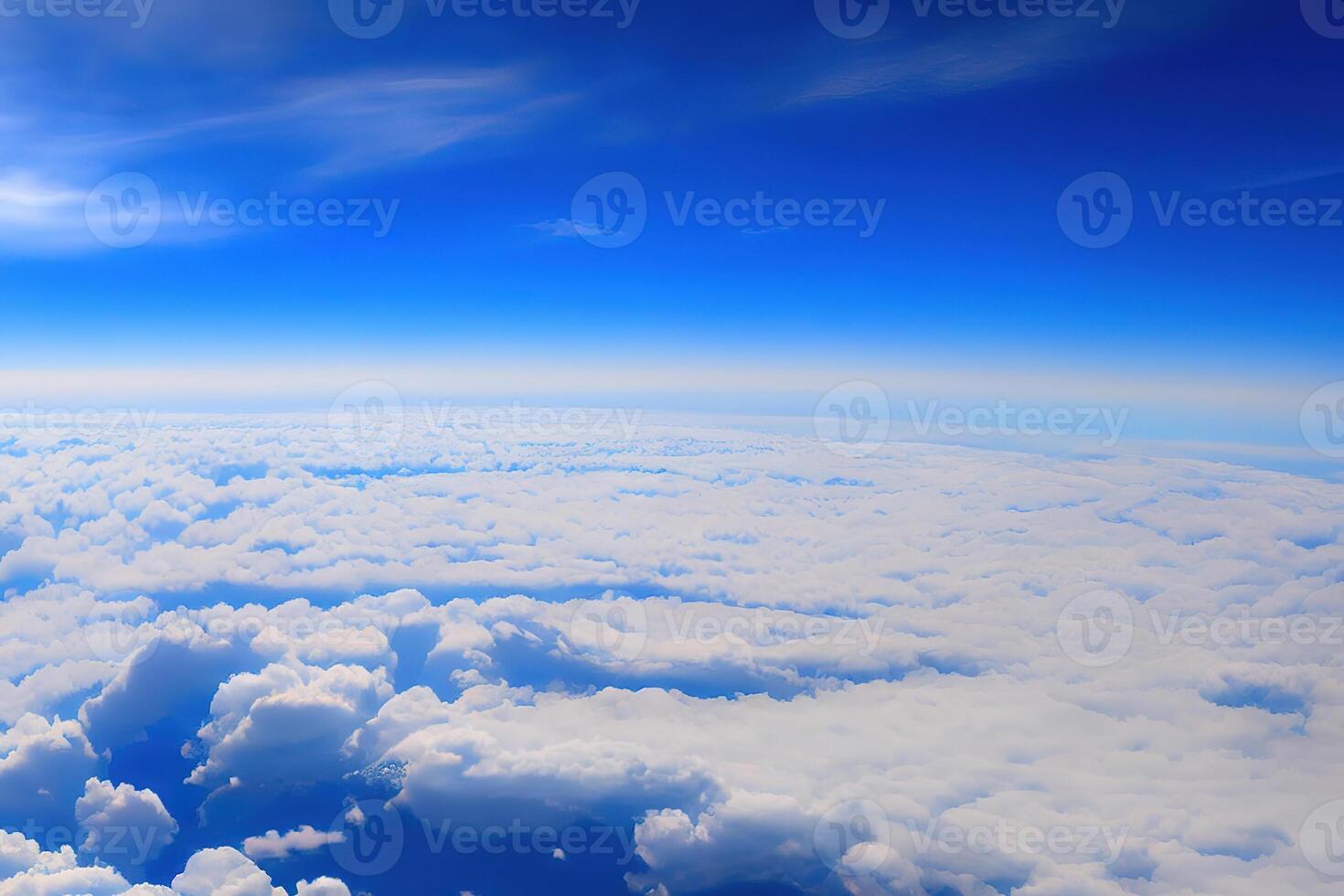 View of the sky above clouds over the earth deep blue sky with white clouds. photo