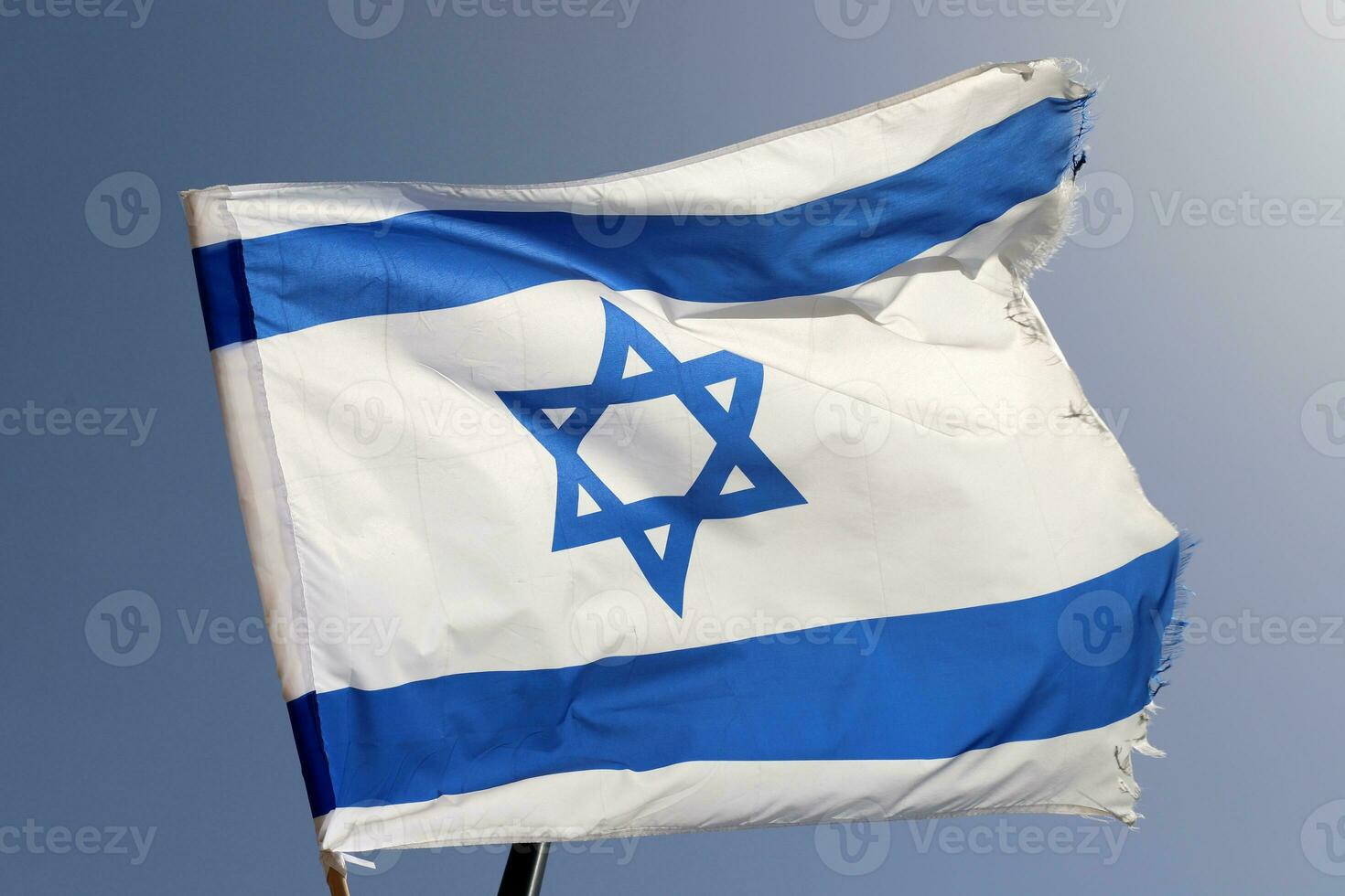 The blue and white flag of Israel with the six-pointed Star of David. photo