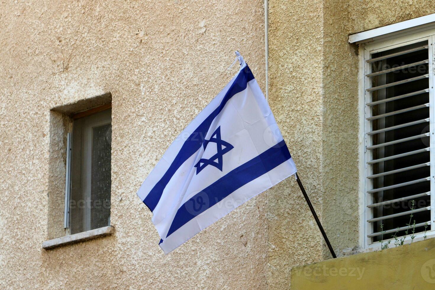 The blue and white flag of Israel with the six-pointed Star of David. photo