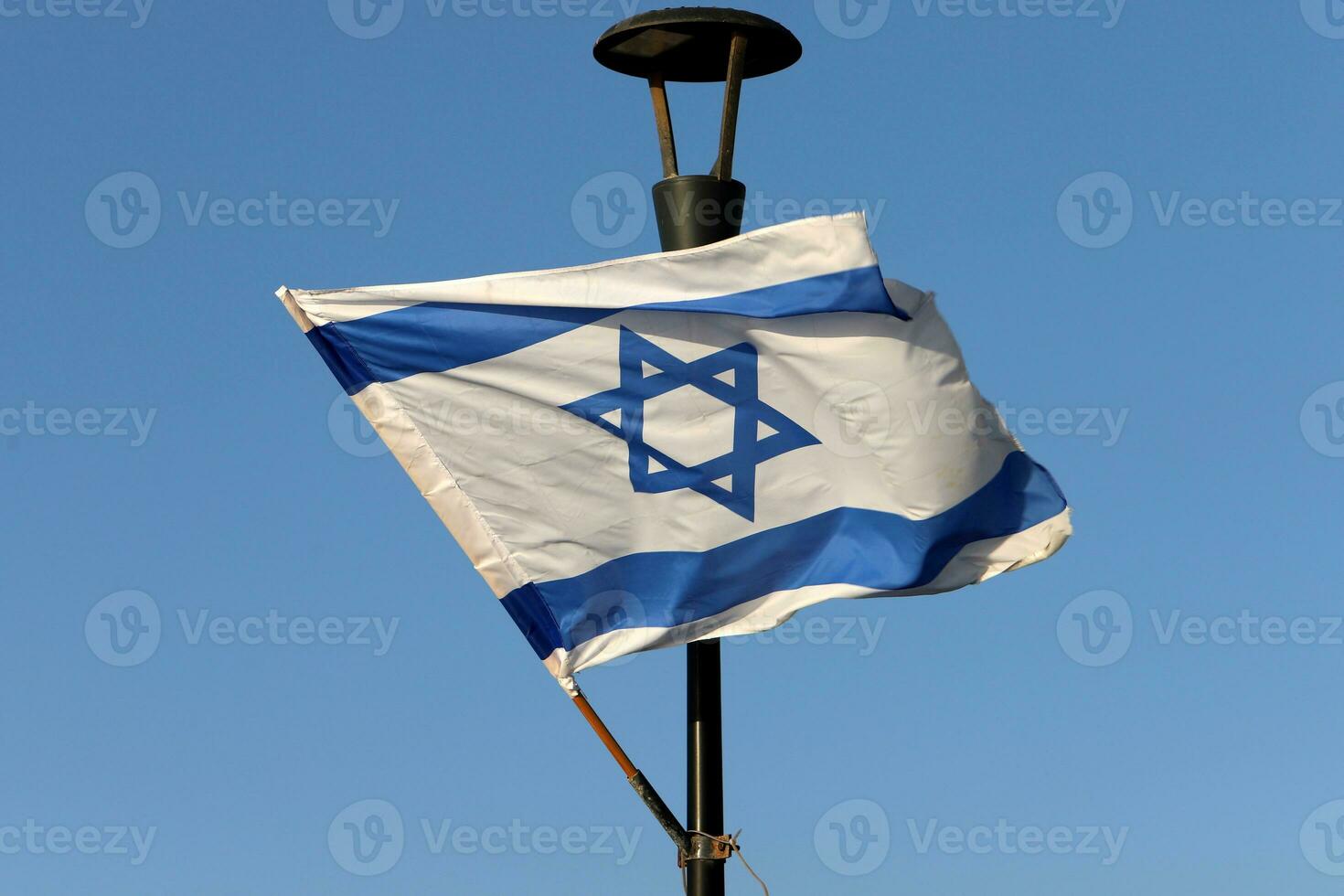 The blue and white flag of Israel with the six-pointed Star of David. photo