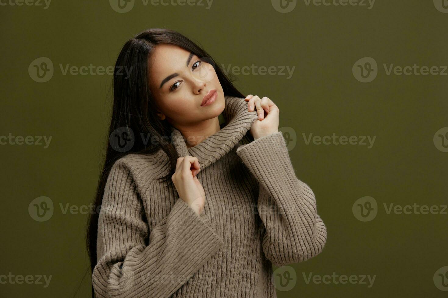 beautiful woman in a sweater posing smile clothing fashion Green background photo