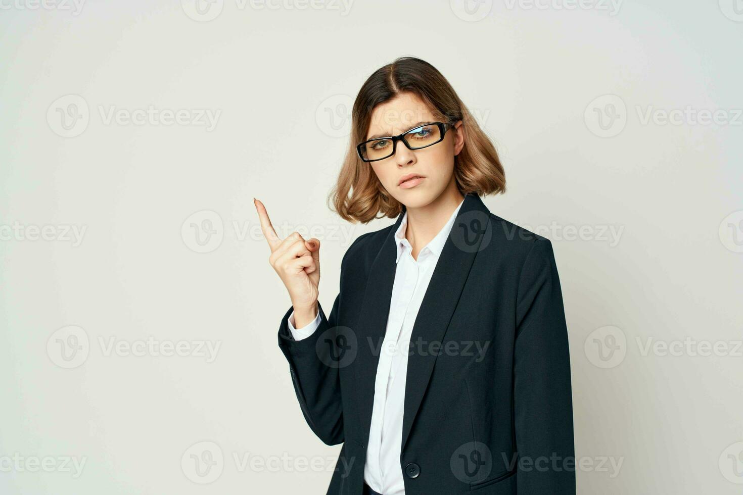 woman in suit gesturing with hand official businesswoman office work photo