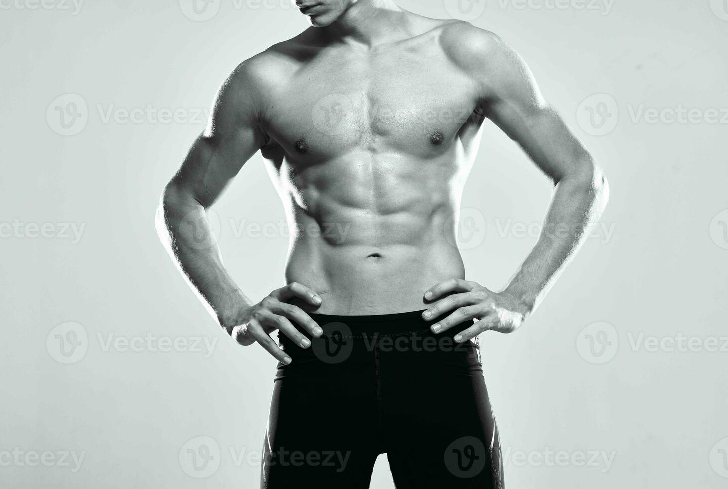 male athlete inflated torso workout posing gym photo