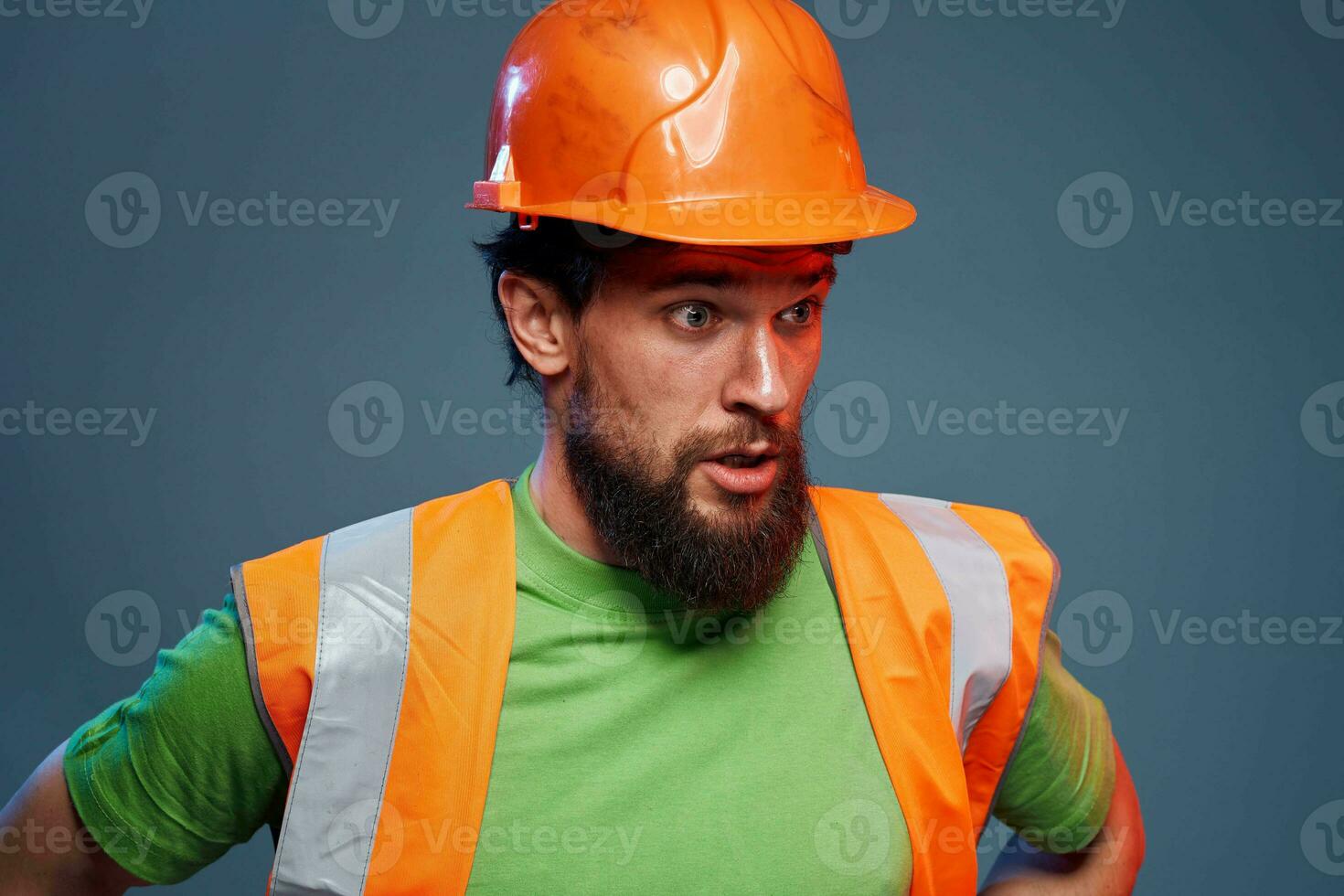 Emotional builders orange hard hat safety work fatigue blue background photo