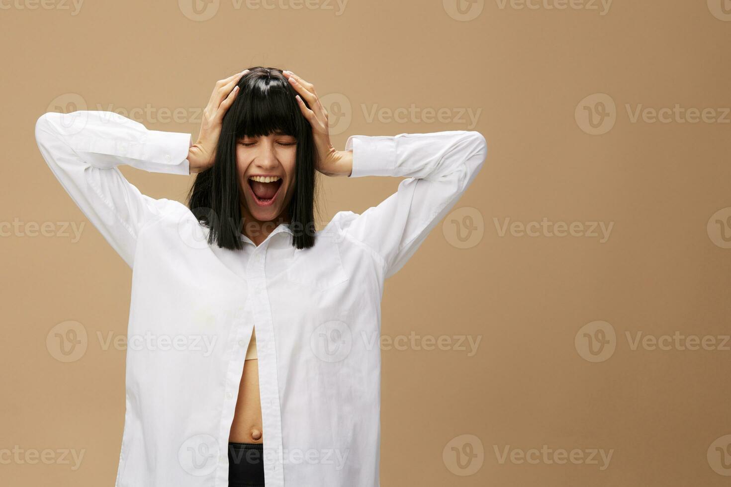 Happy enjoyed cute stylish adorable brunet lady in white shirt flirting smiling posing isolated on pastel beige studio background. Copy space Banner Offer. Pulp Fiction concept. Fashion Cinema photo