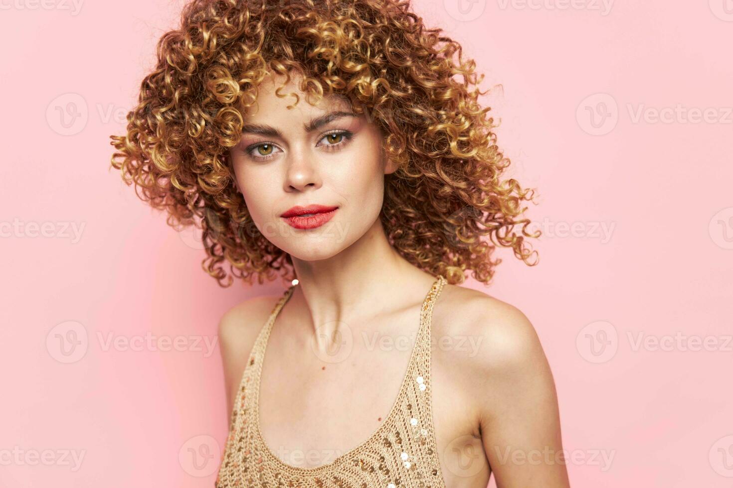 Model Curly hair attractive look red lips pink background photo