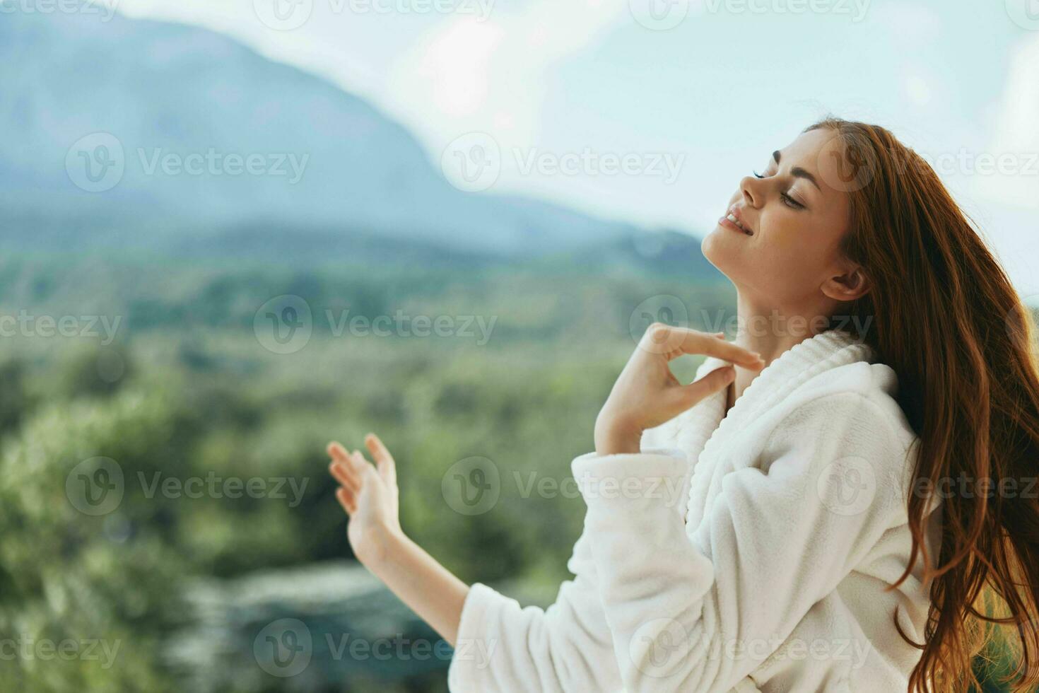 woman looks at a beautiful view from the balcony unaltered photo