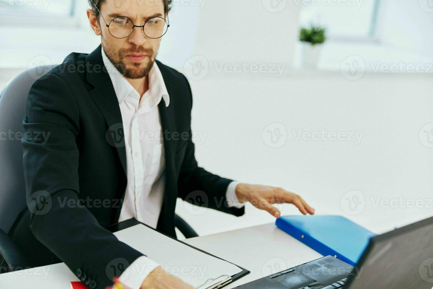 businessman work in the office in front of a laptop executive photo