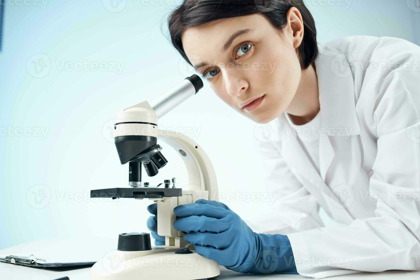 woman with microscope laboratory microbiology technology science photo