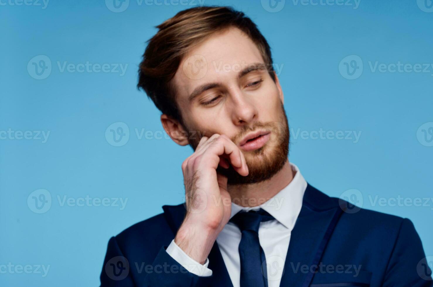 business man in suit cropped view blue background close-up photo