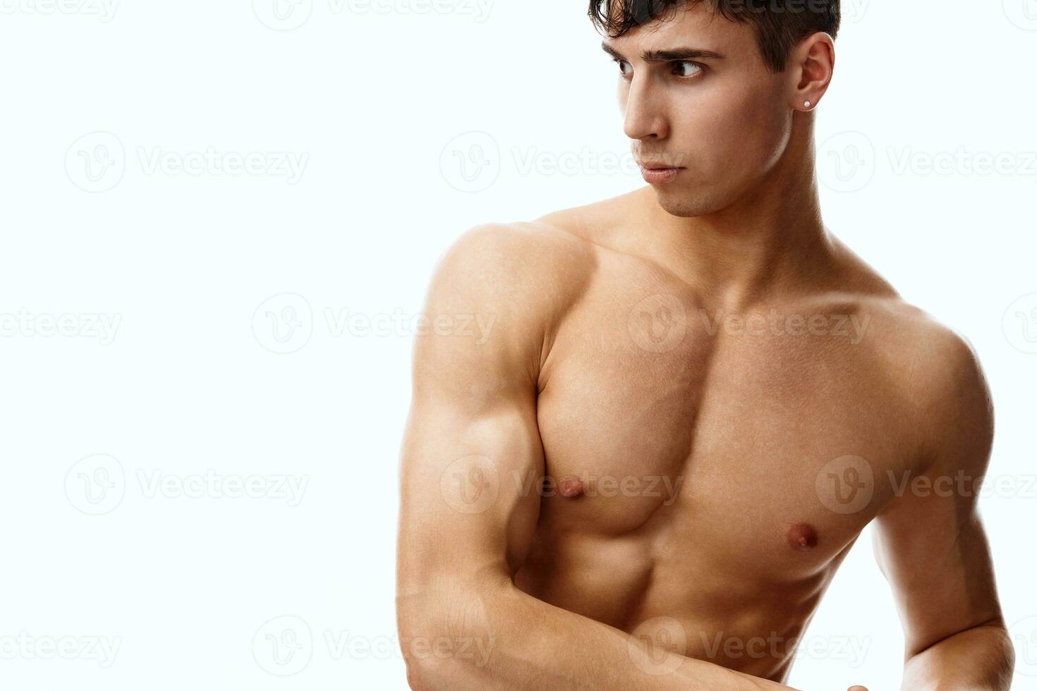 male athlete with biceps and cubes on the stomach naked torso model photo