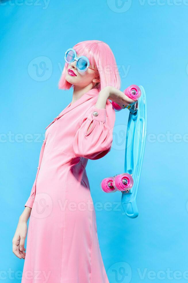 pretty woman in sunglasses wears a pink wig studio model unaltered photo