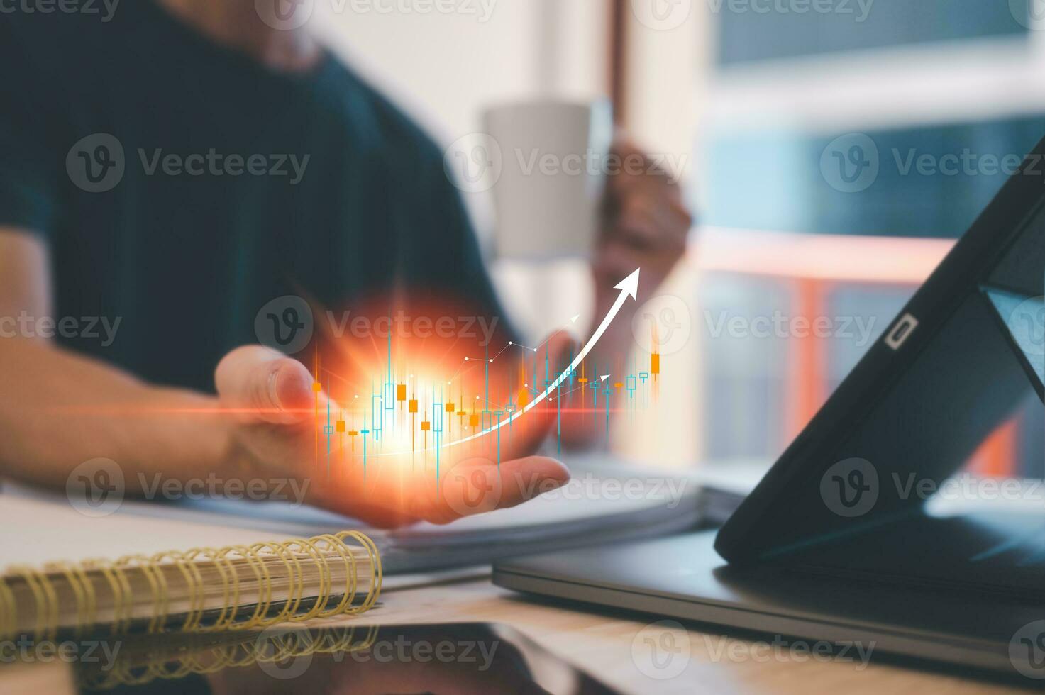 business planning investment strategy concept, man holding virtual trading graph increasing arrow and virtual light working on busy table in office photo