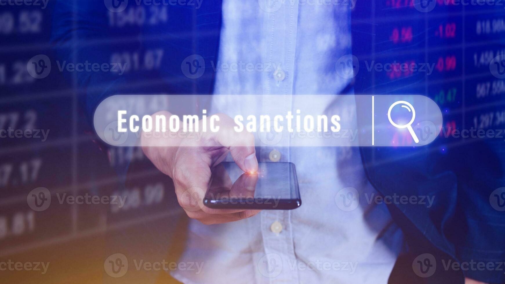 Economic sanctions, written in search bar with the financial data visible on background with smartphone. Reports Stock Market Ticker Words photo