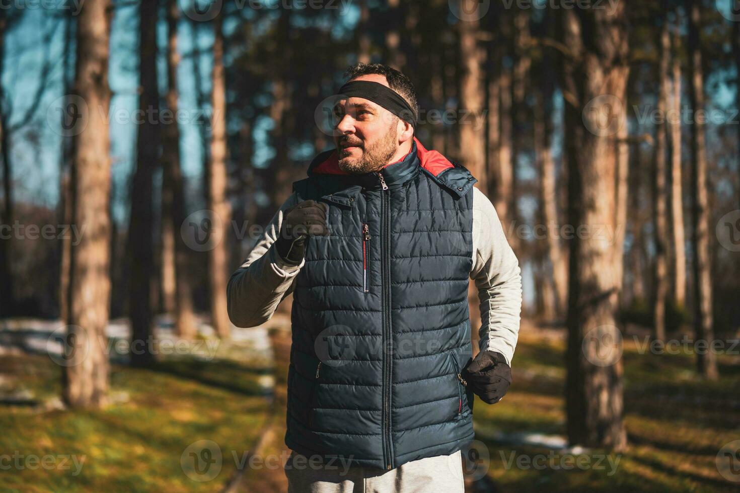 Boxer is training at the park in the winter. He is working on his fitness. photo