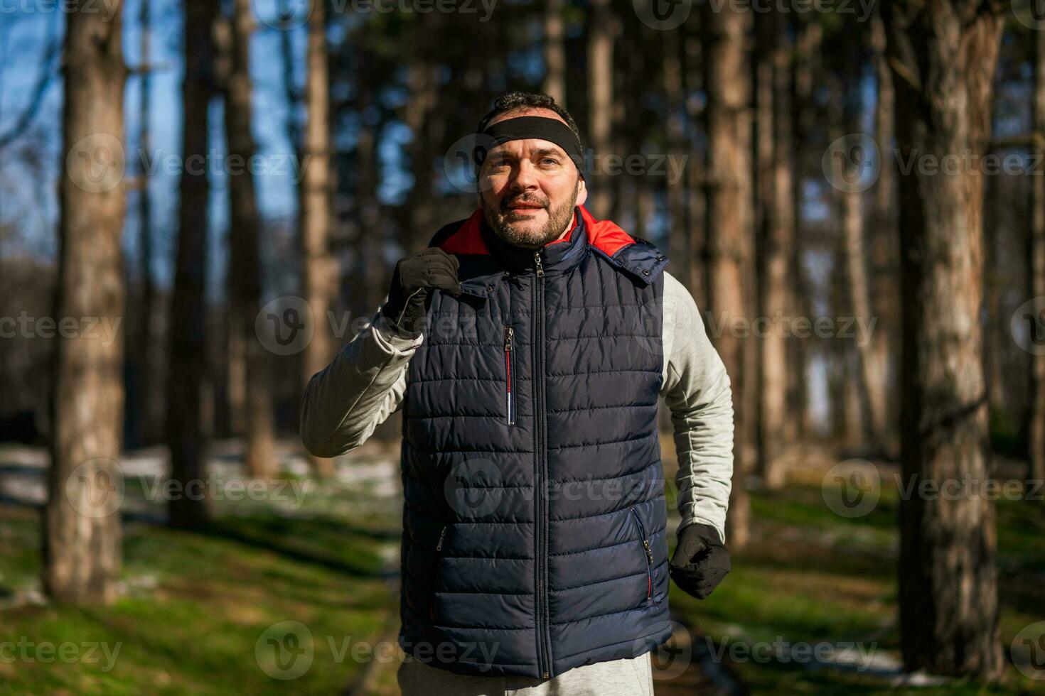 Boxer is training at the park in the winter. He is working on his fitness. photo