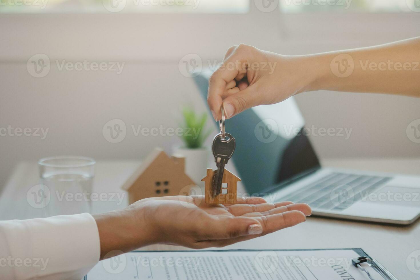 Deal done landlord, realtor man hold key offer new renter, tenant or client after banker approved, signed purchase agreement. Finance, financial of property, estate mortgage or apartment, home loan photo