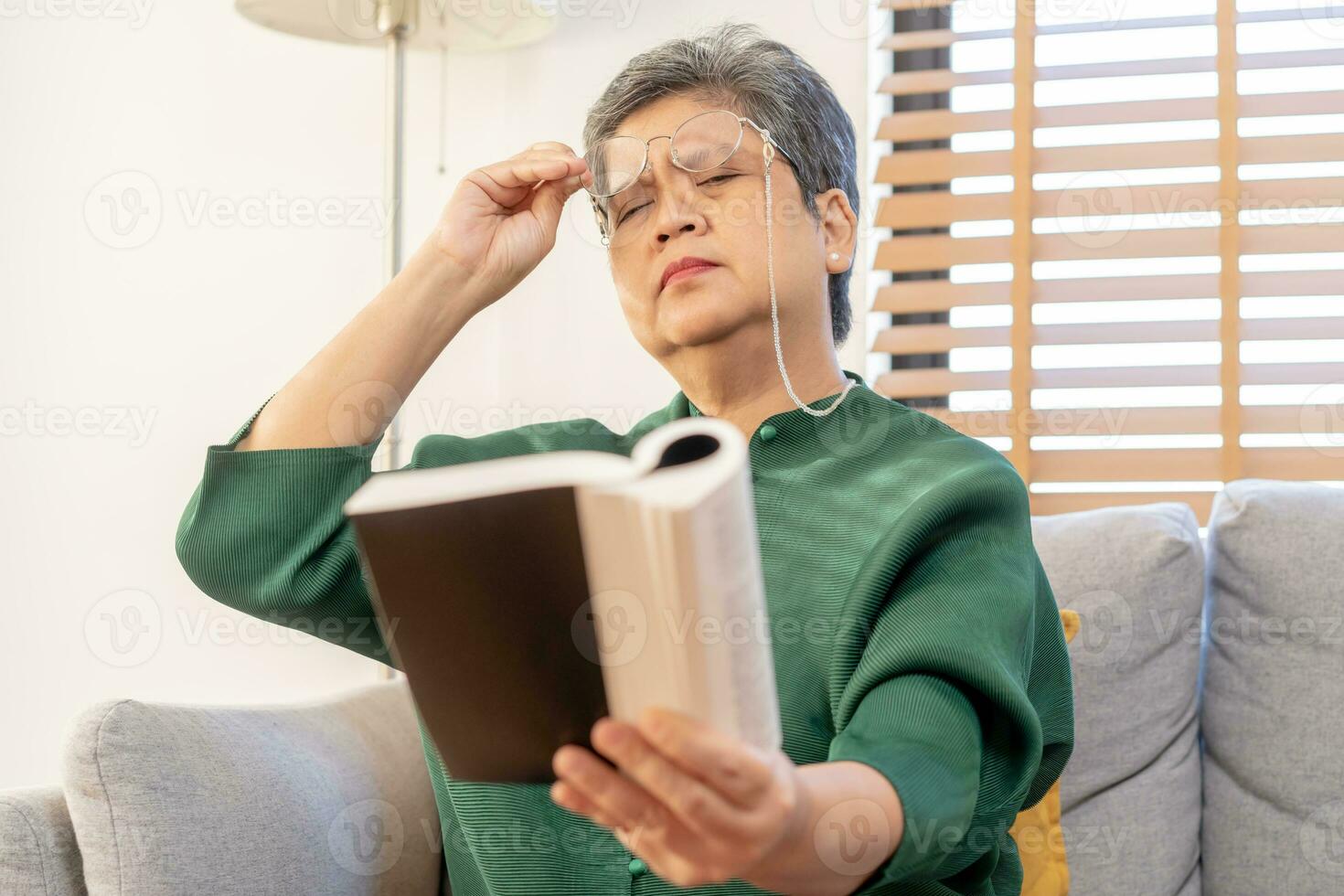 Presbyopia, Hyperopia mature asian woman holding eyeglasses having