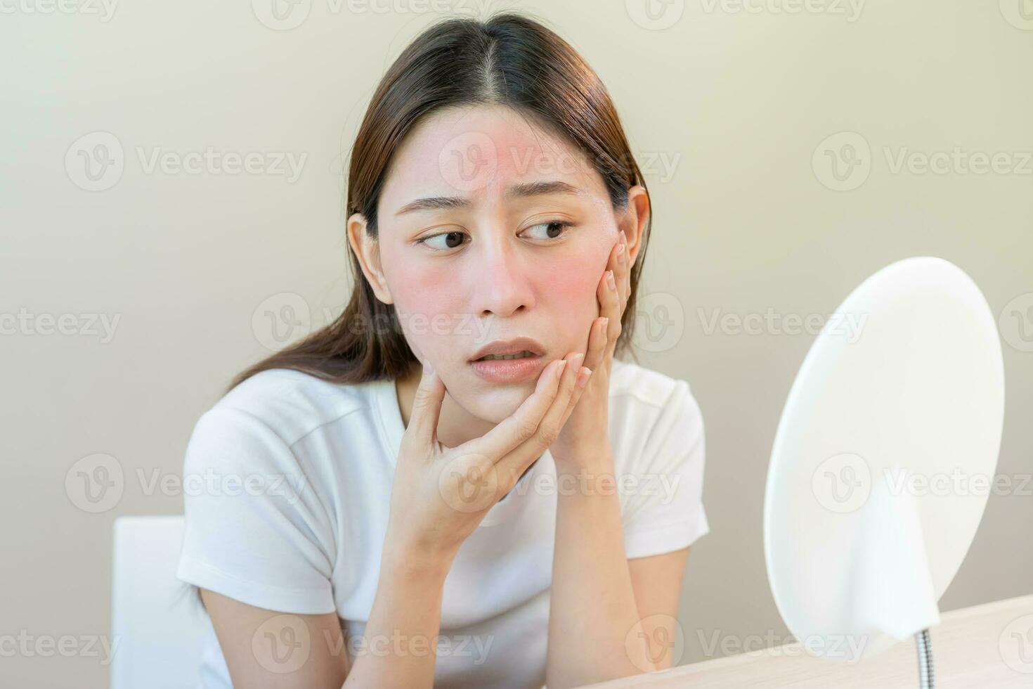 Dermatology, puberty asian young woman, girl looking into mirror