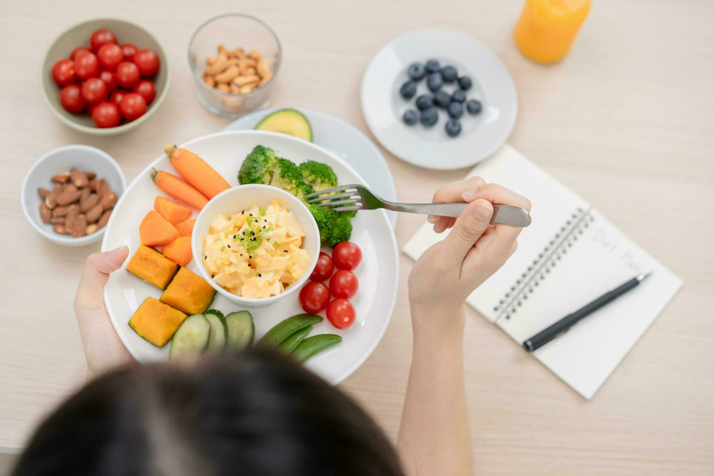 Diet, Dieting asian young woman or girl holding, using fork at broccoli on mix vegetables, green salad bowl, eat food is low fat good health. Nutritionist female, Weight loss for healthy person. photo