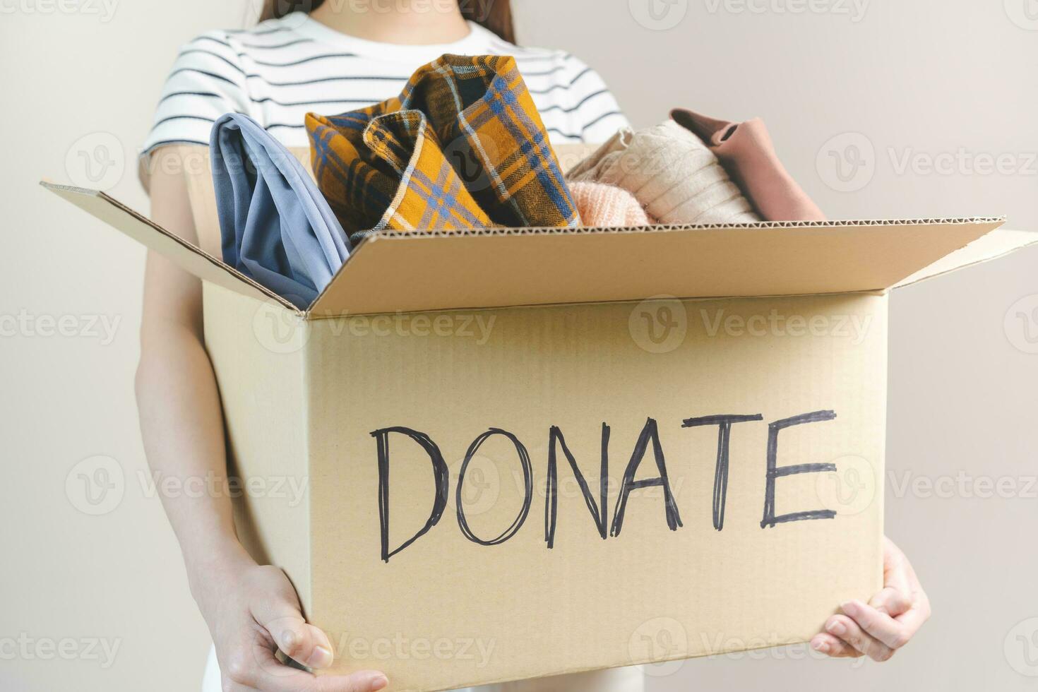 Recycling, Donation for poor, asian young woman pack, hand in holding donate box full with second hand clothes, charity helping and needy people. Reuse recycle, moving of object on white background. photo