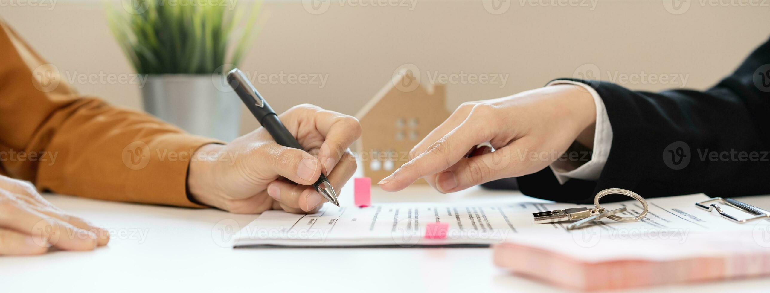 Financial, asian woman lease landlord, agent banker or bonding hand is pointing to contract of tenant, new owner or renter of home to sign signature on purchase, rental property. Estate mortgage. photo