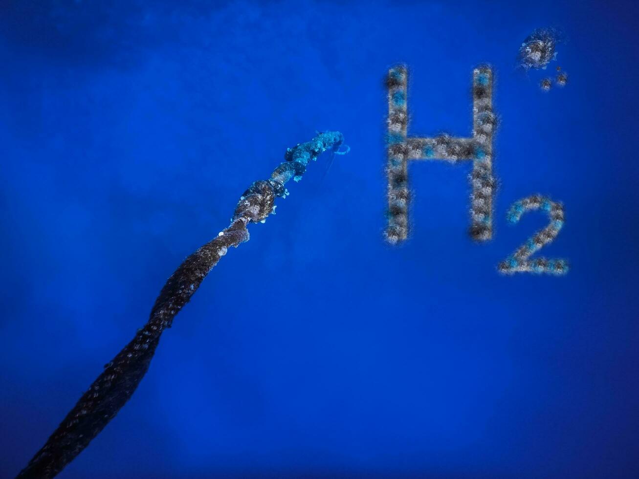 3D illustration pure energy dark blue h2 hydrogen at a long rope to the bottom of the sea with blue water photo
