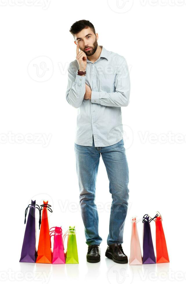 Handsome man with shopping bags photo