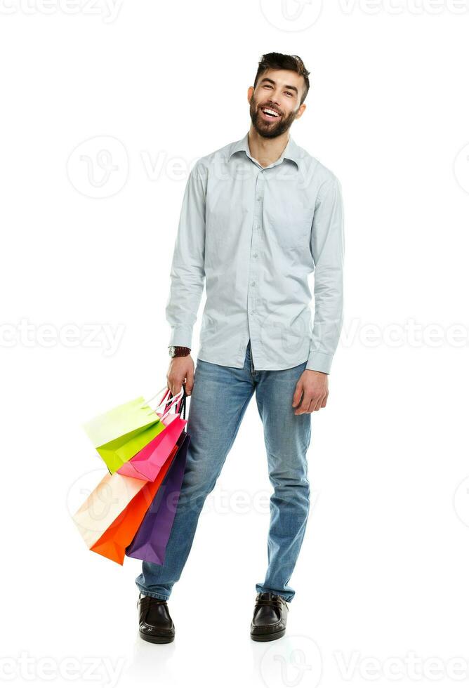 Handsome man holding shopping bags 23259623 Stock Photo at Vecteezy