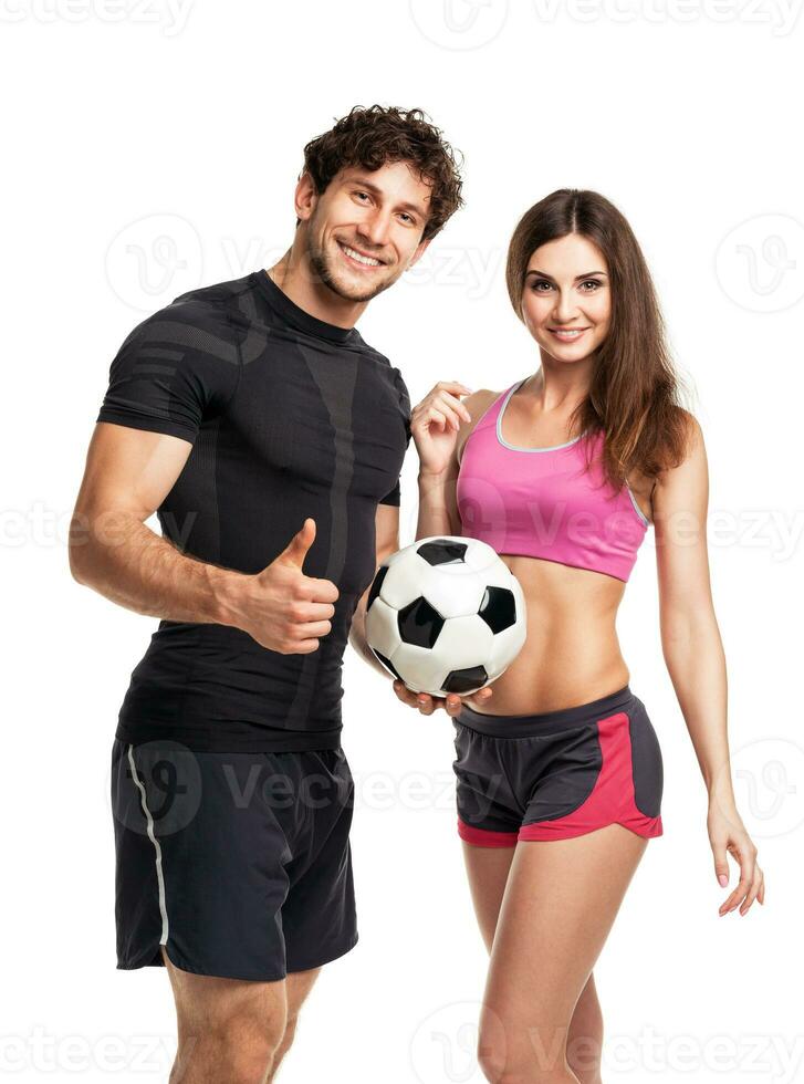 Athletic man and woman with ball on the white photo