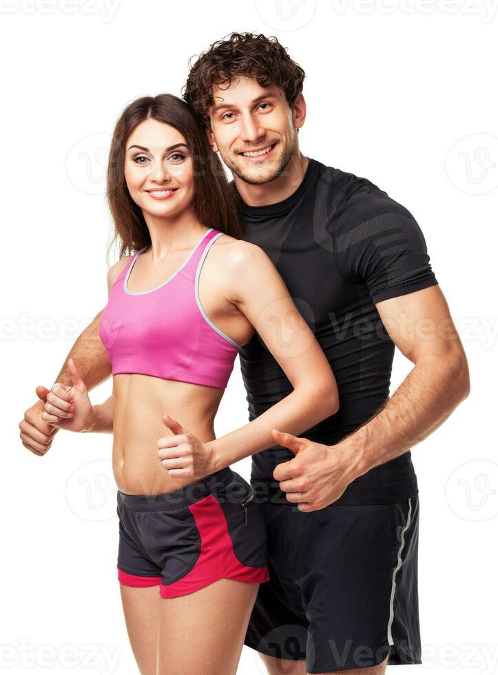 Athletic man and woman after fitness exercise with a finger up on white photo