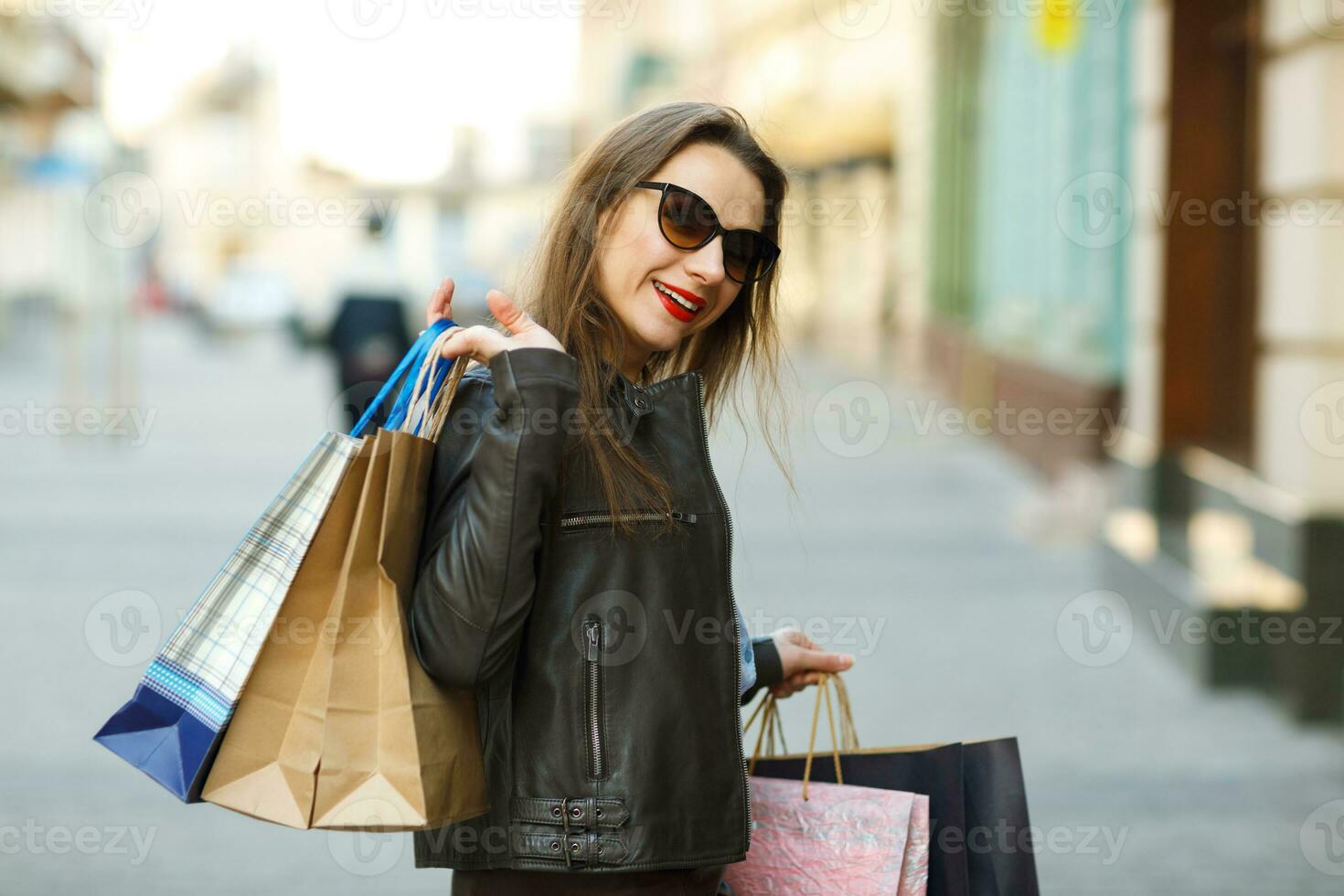 Beautiful woman with shopping bags in the ctiy photo