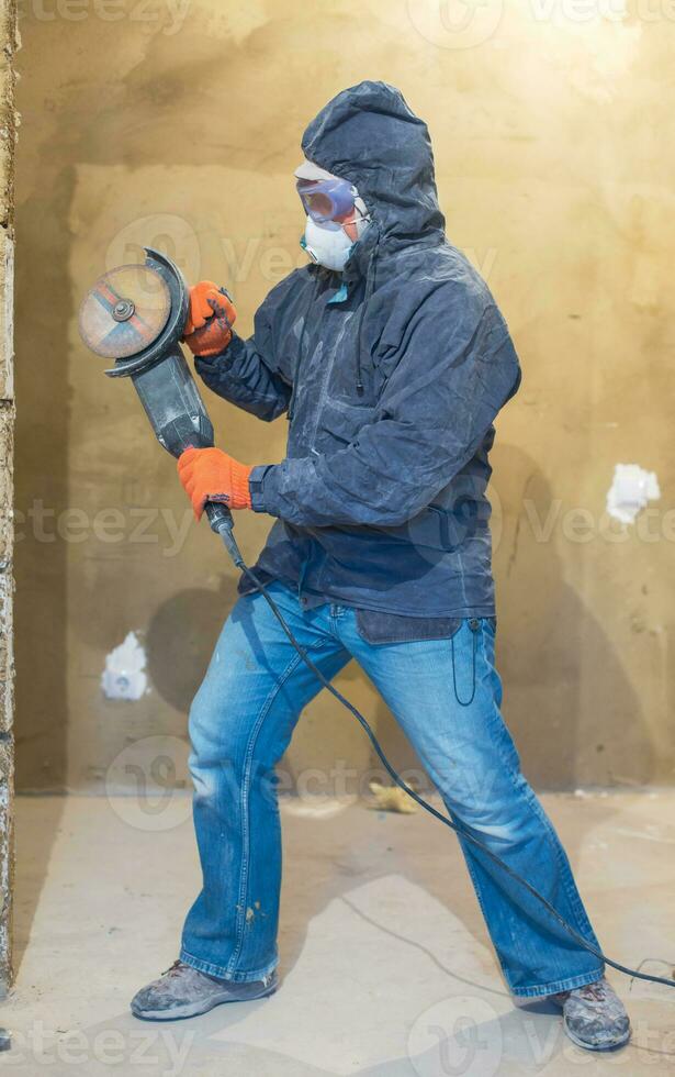 Repairman with grinder photo