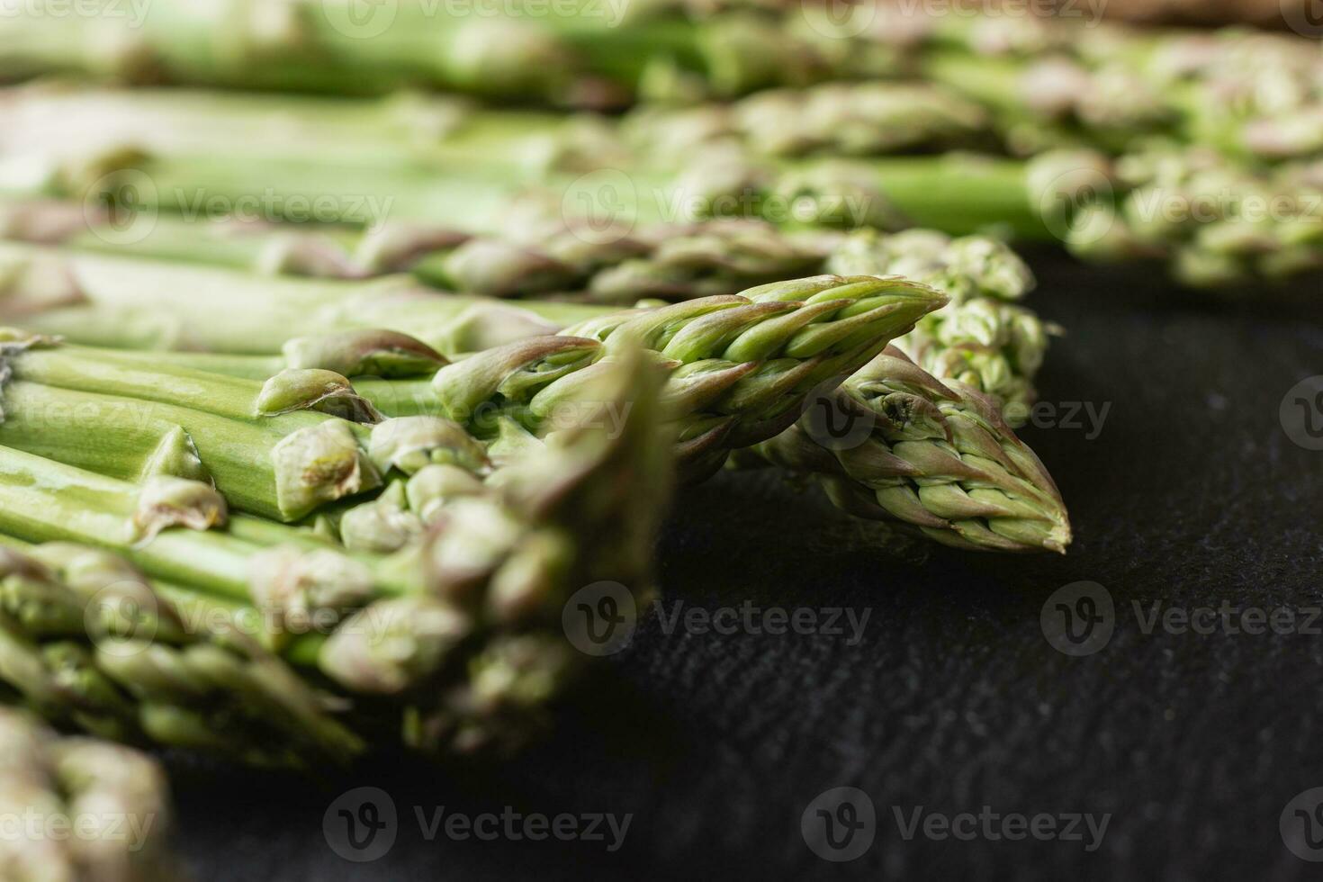 Green asparagus on a black background photo