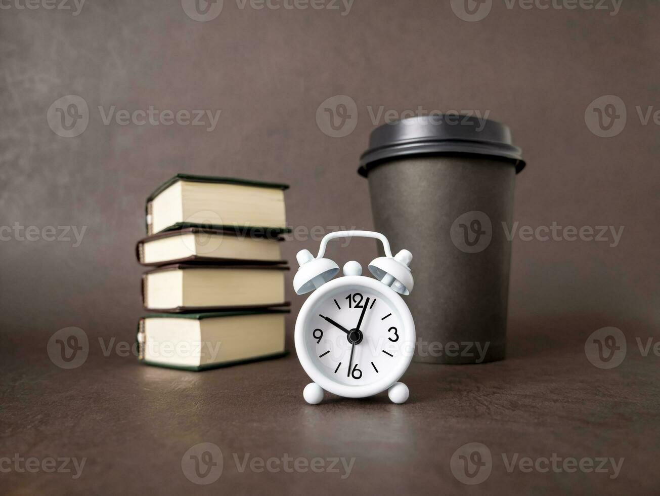 Watch, books, a cup of coffee. The concept of business, education, and training. Reading books and preparing for exams photo