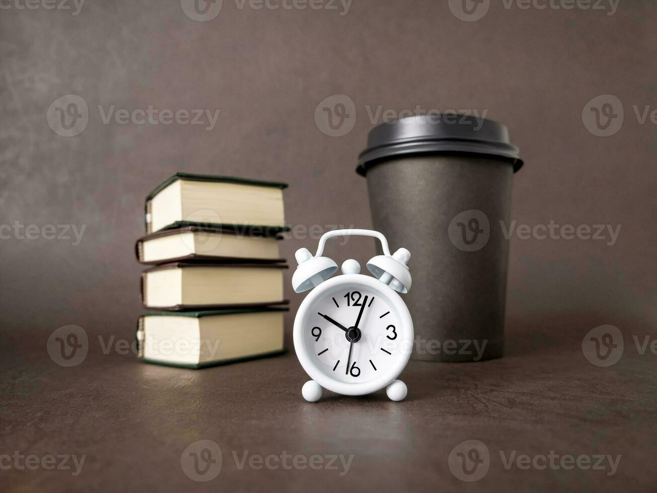 Watch, books, a cup of coffee. The concept of business, education, and training. Reading books and preparing for exams photo